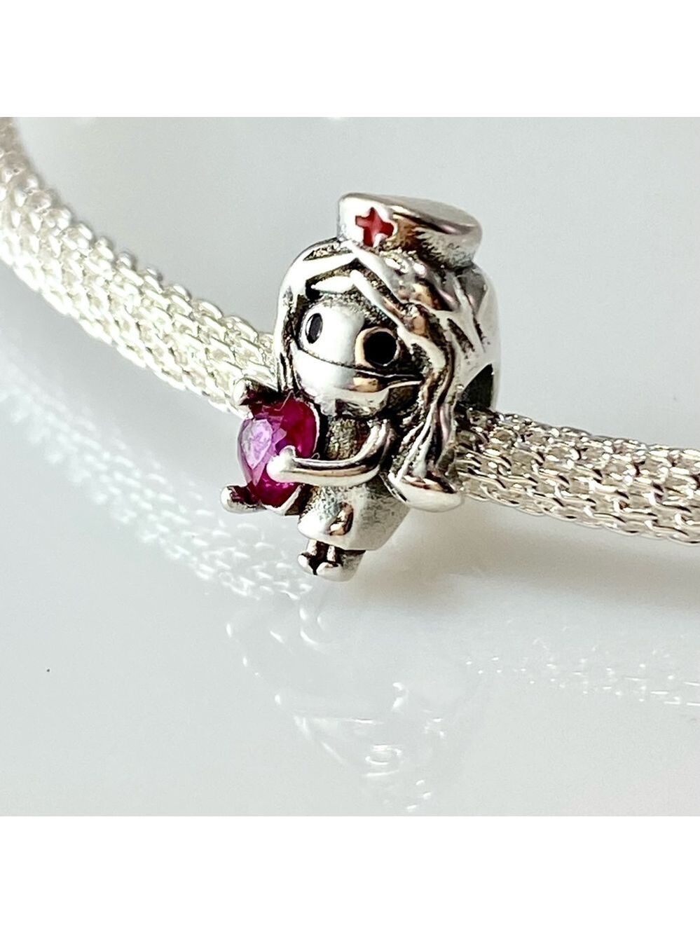 Sterling Silver Nurse with Heart Charm